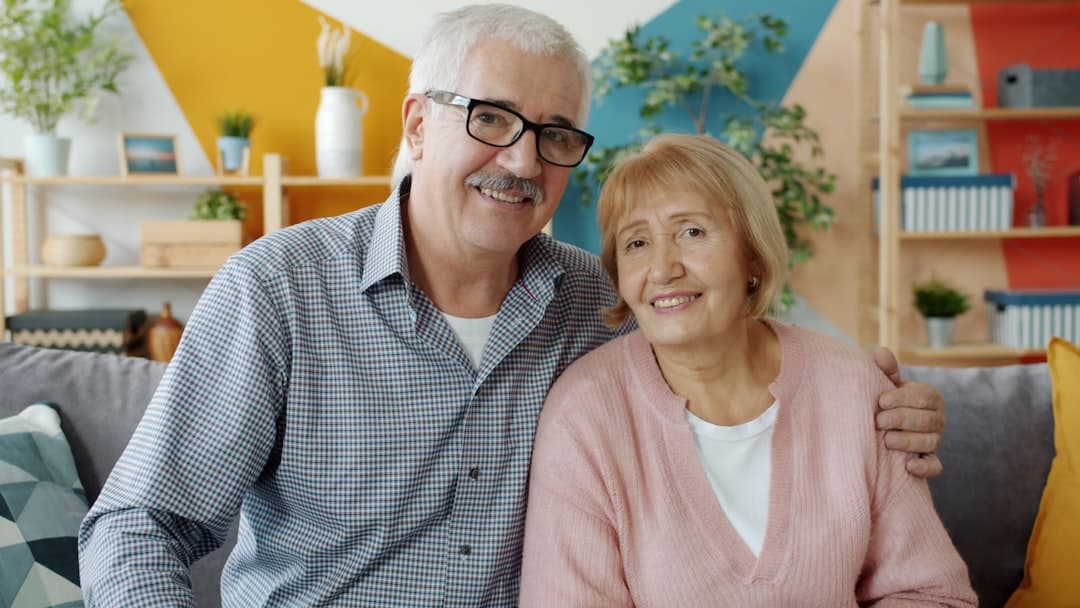 Couple celebrating Medicare eligibility at 65